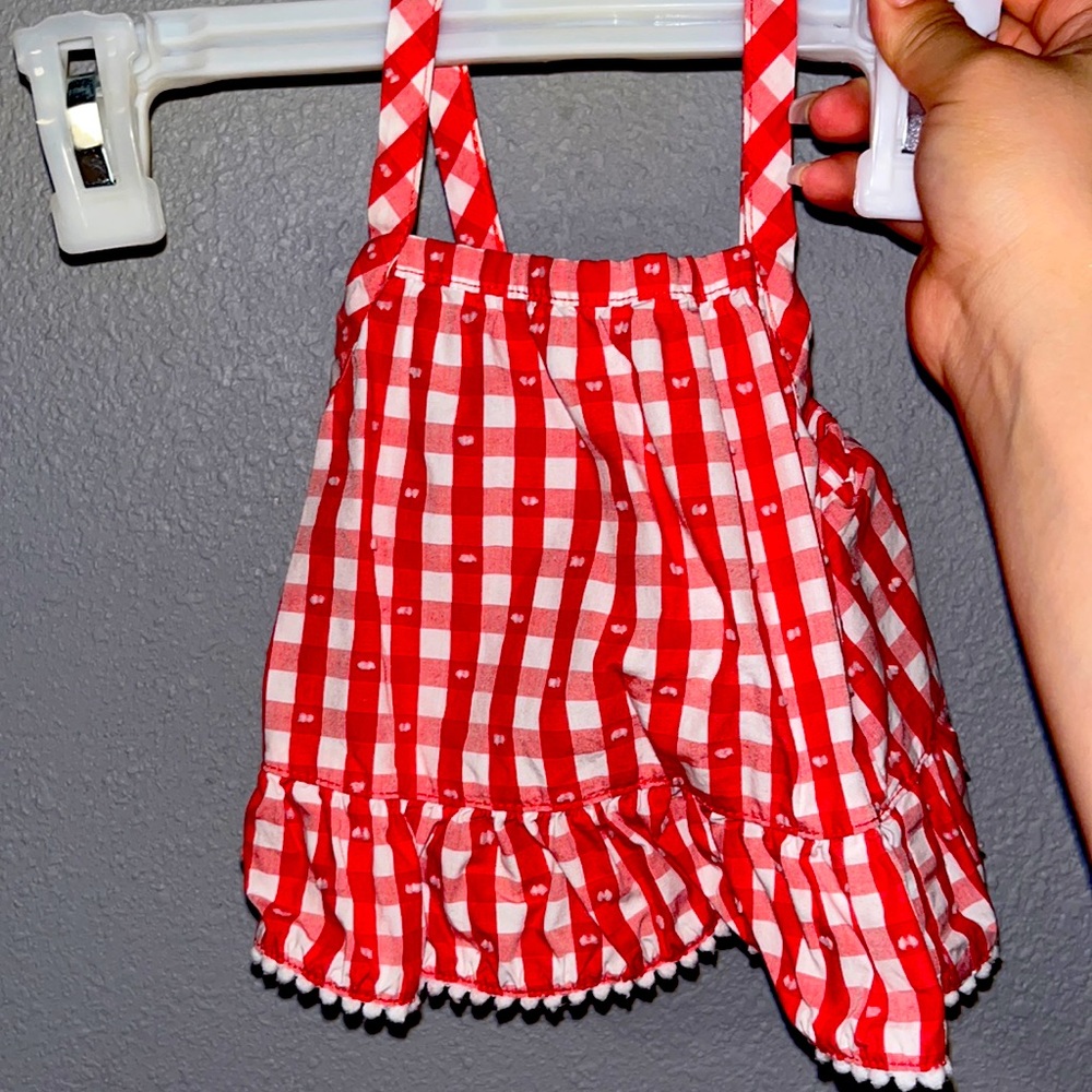 Red & White baby strap top. Super cute and goes good with any color pants.